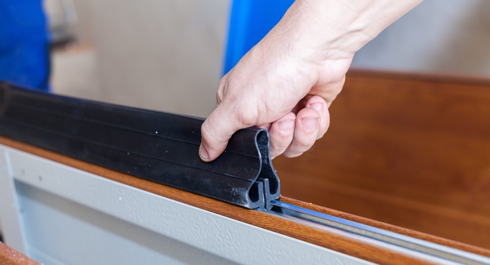 Flexible garage door bottom seal fitted into its metal retainer