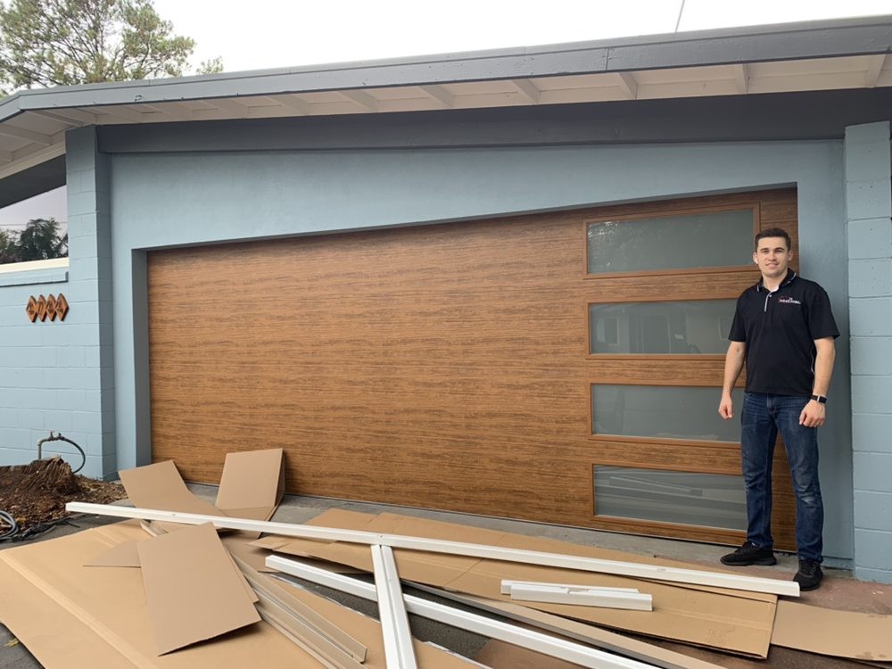 Brown sectional garage door during installation
