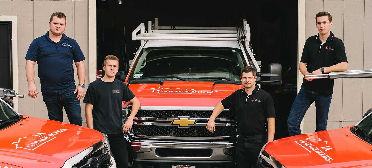 1A Garage Doors team with branded service vehicles